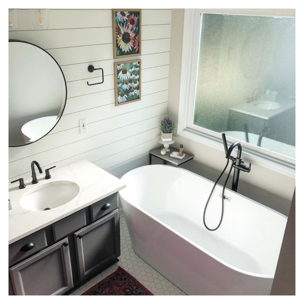 newly remodeled bathroom with sink and tub