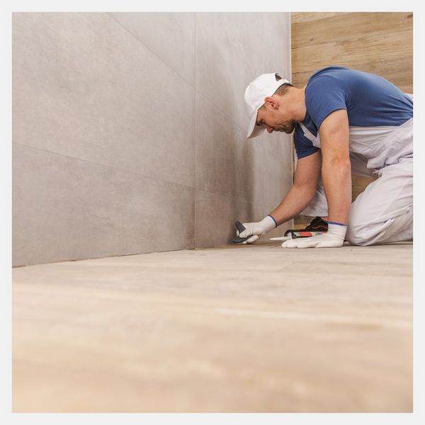 contractor installing new tile