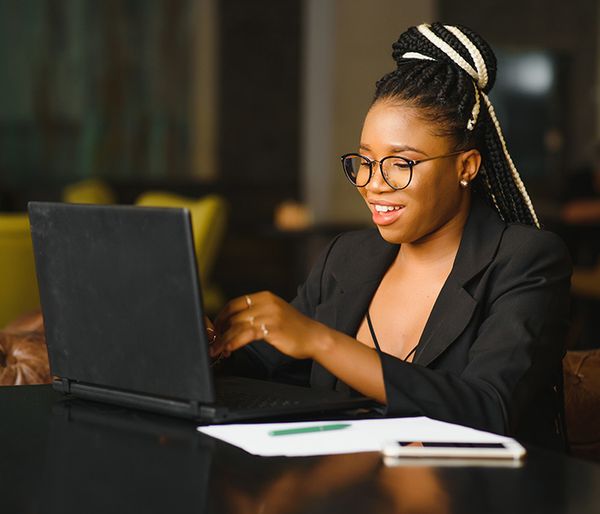 Image of a woman signing up on her computer