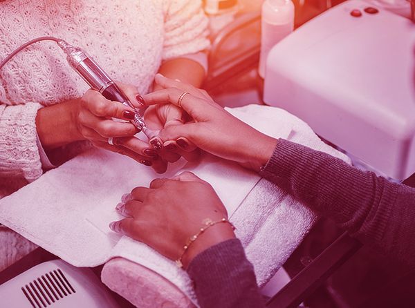 Image of a woman getting her nails done