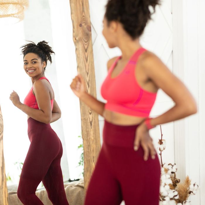 woman looking in mirror