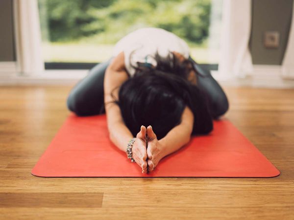 woman doing yoga practice at home