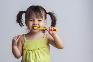 Image of little girl brushing her teeth