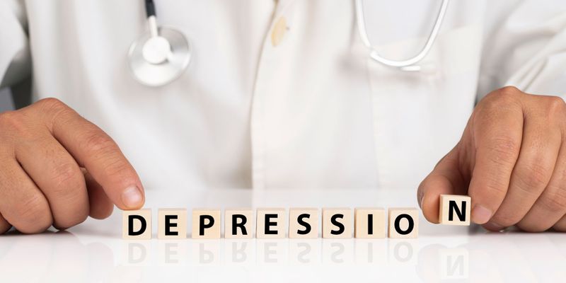 doctor putting the word blocks "depression" together