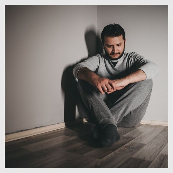 man sitting on floor 