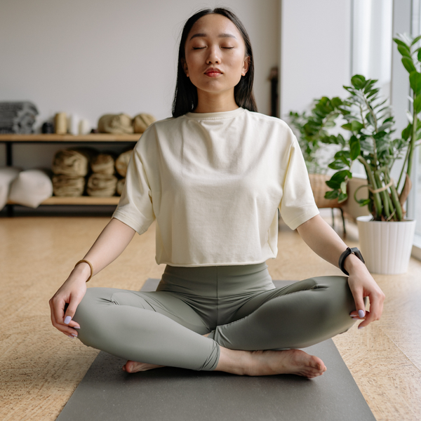 A woman doing breathing exercises.