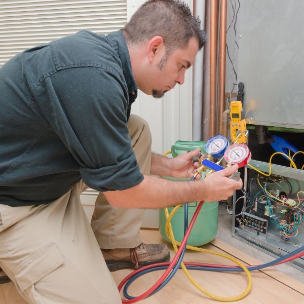 hvac tech working on hvac system