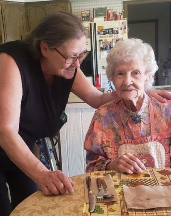 Care Assistant helping senior with meal time Meal Preparation
