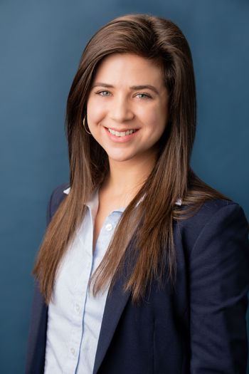 young woman with long brown hair smiling 