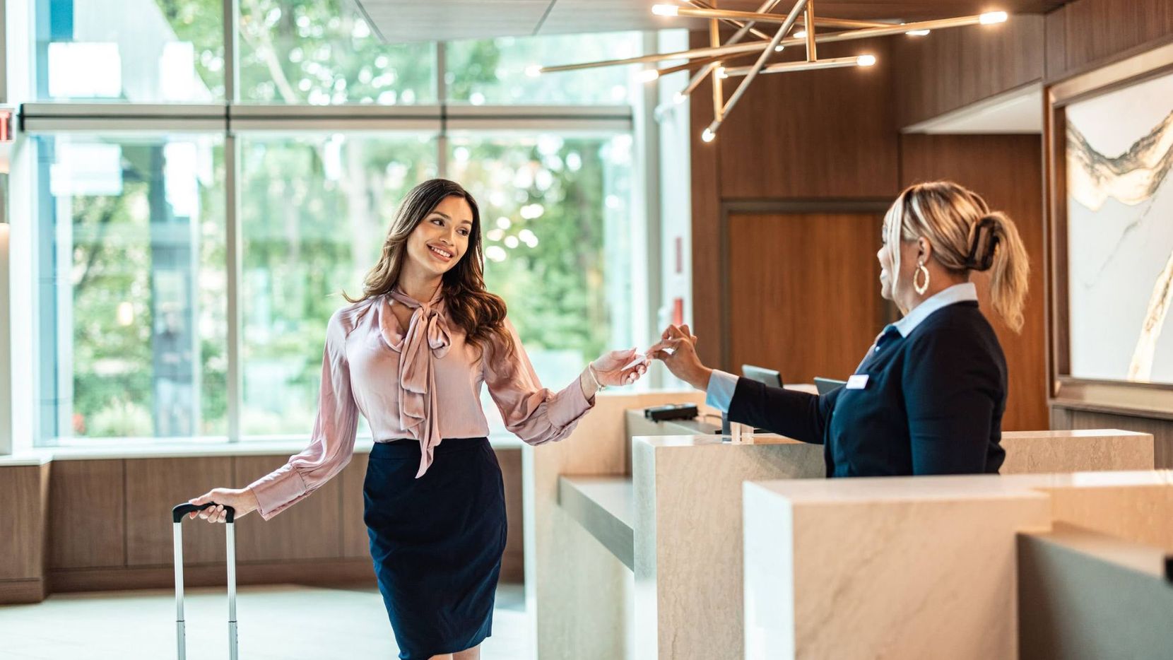 Woman checking into hotel