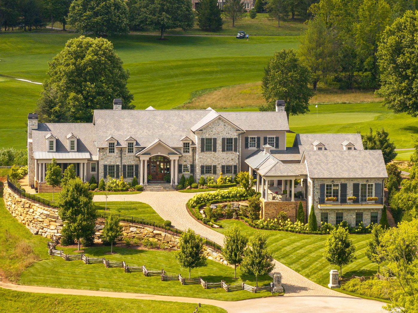 drone view of property with guest house 