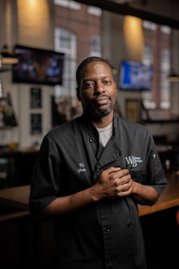 Restaurant owner standing inside his restaurant 2022-01-06 BLOG Woodside Bistro - TOWN Magazine - Greenville, SC - Jack Robert Photography 17