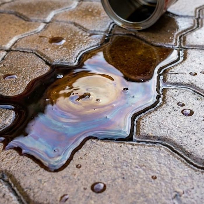 oil pooling on a sealed paver patio