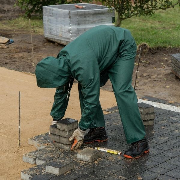 Contractor installing pavers.