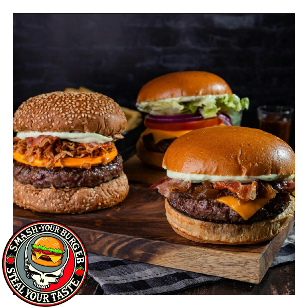 three burgers sitting on cutting board