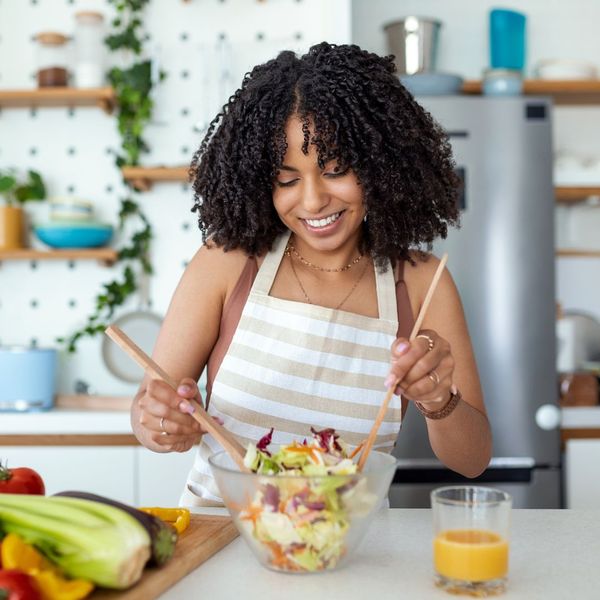 A woman making a healthy salad