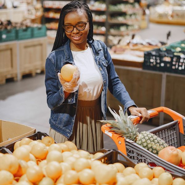 A young woman looking at fresh produce