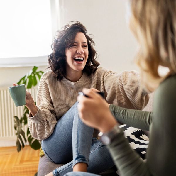 Two friends talking and laughing