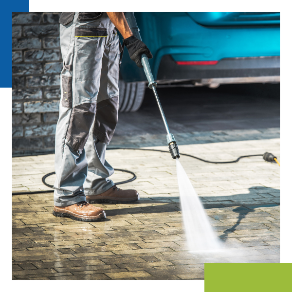 technician pressure washing driveway technician pressure washing driveway