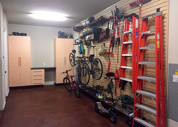 photo of garage with light wood slat wall installed