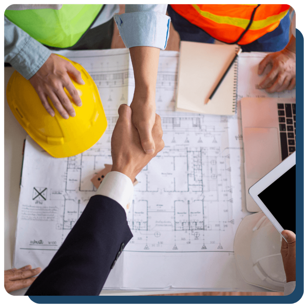 home remodeling contractor shaking hands with a client