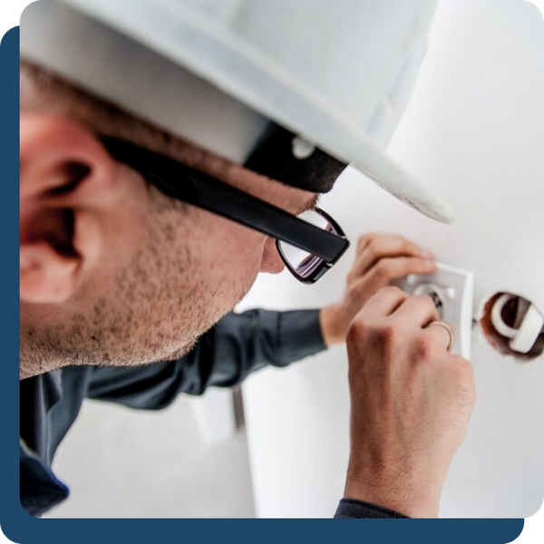 electrician working on outlet