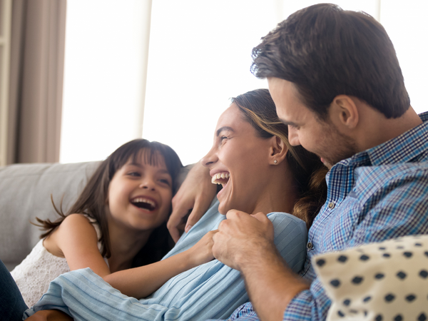 Image of a family sitting on a couch