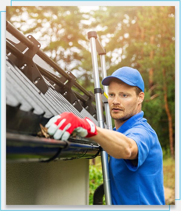 technician cleaning gutter