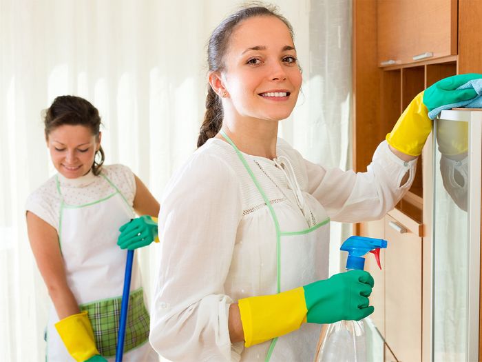 2 women cleaning together