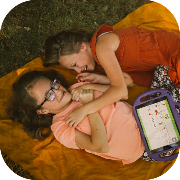 two siblings laughing together 