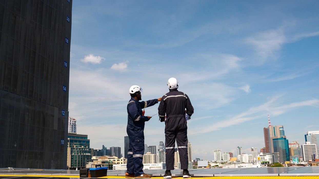 workers looking over city