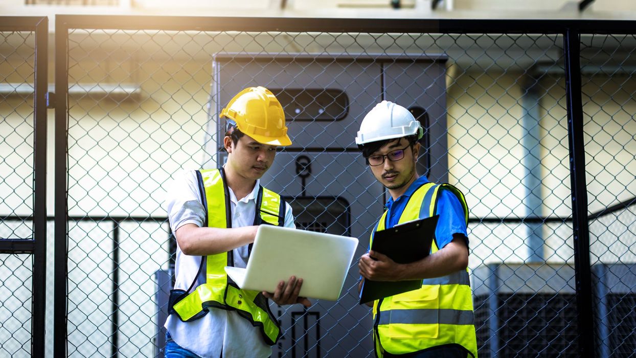 workers looking at reports