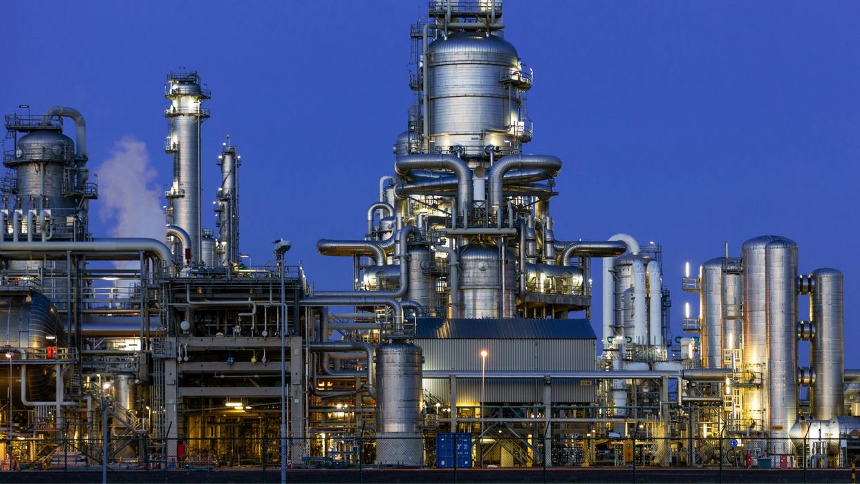 a steel mill or refinery at dusk