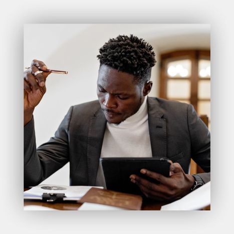 business man looking at data via tablet business man looking at data via tablet