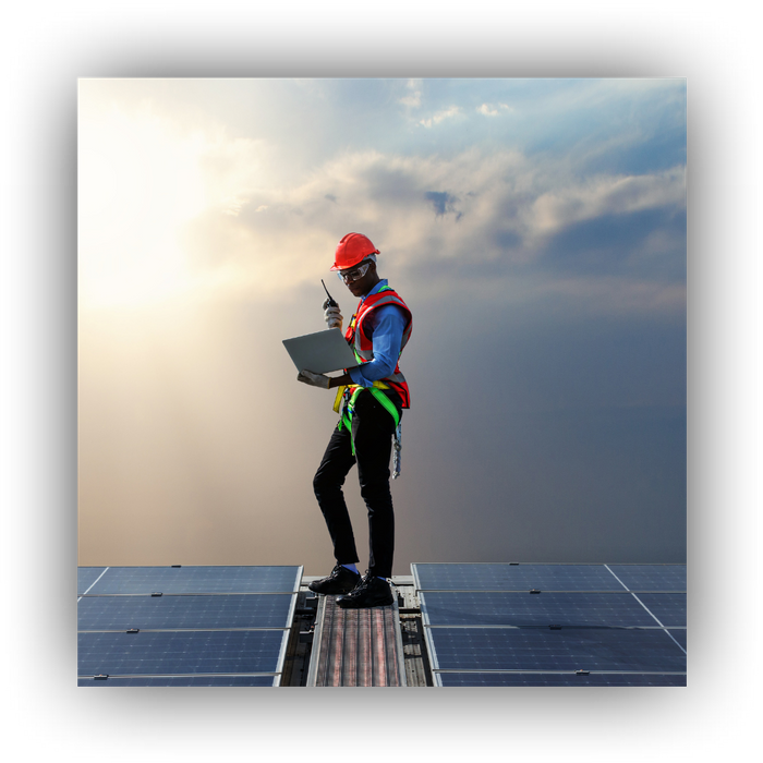 worker on roof with panels