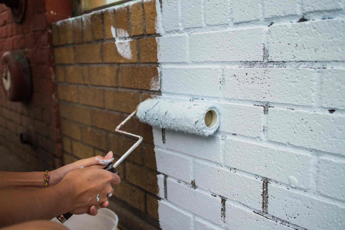painting-brick-wall-scaled.jpeg