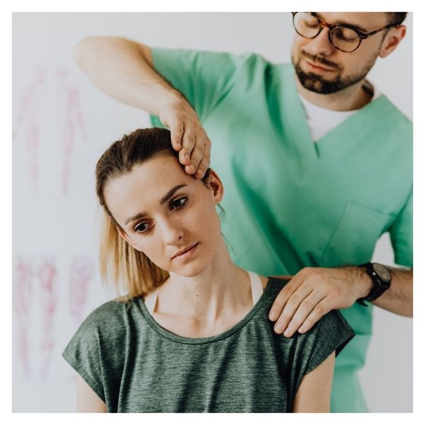 chiropractor working on patient's neck