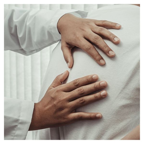 chiropractor working on patient's back