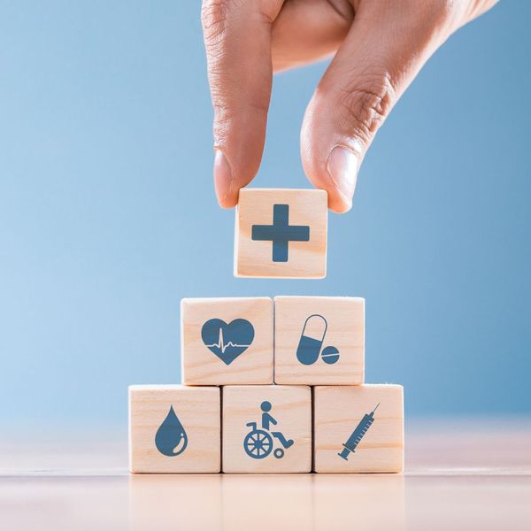 Wooden blocks with various medical icons on them. 