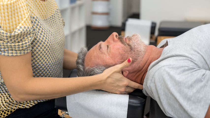older man getting chiropractic adjustment