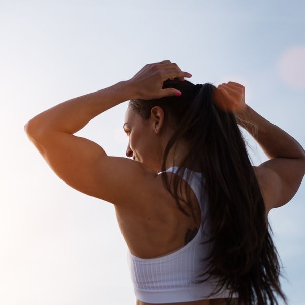 Woman tying her hair