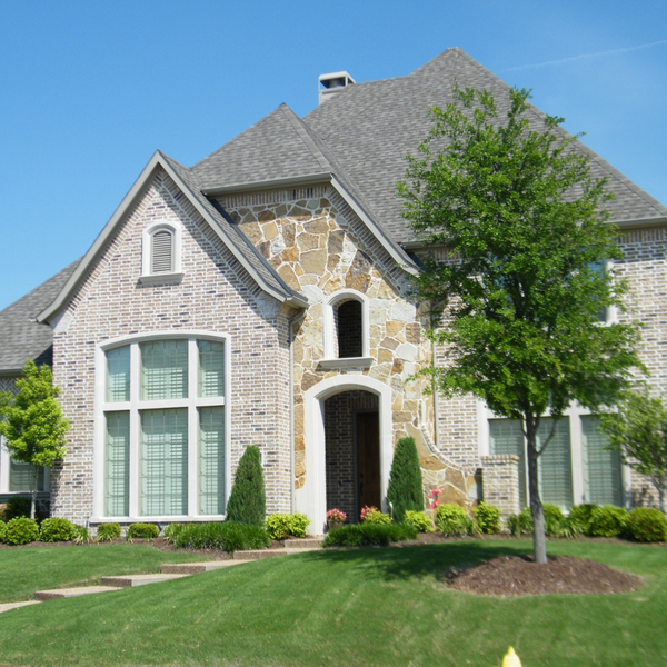 the front yard of a beautiful home