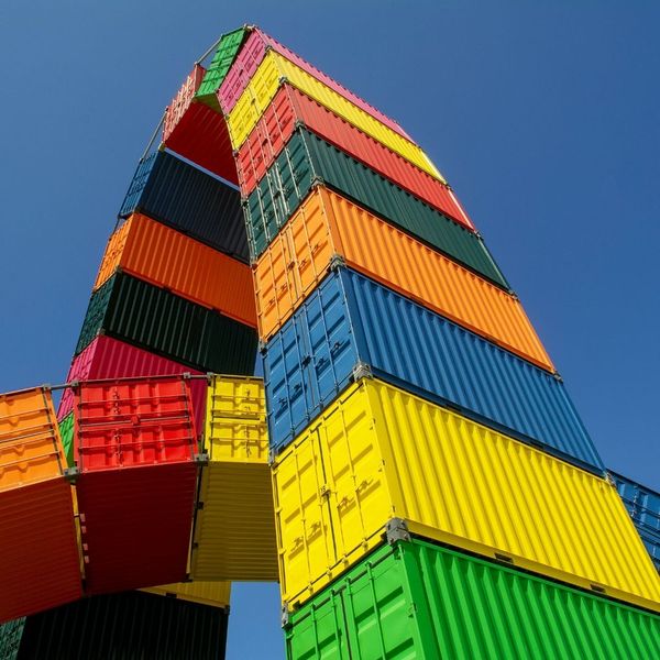 whimsical arcing structure made from containers