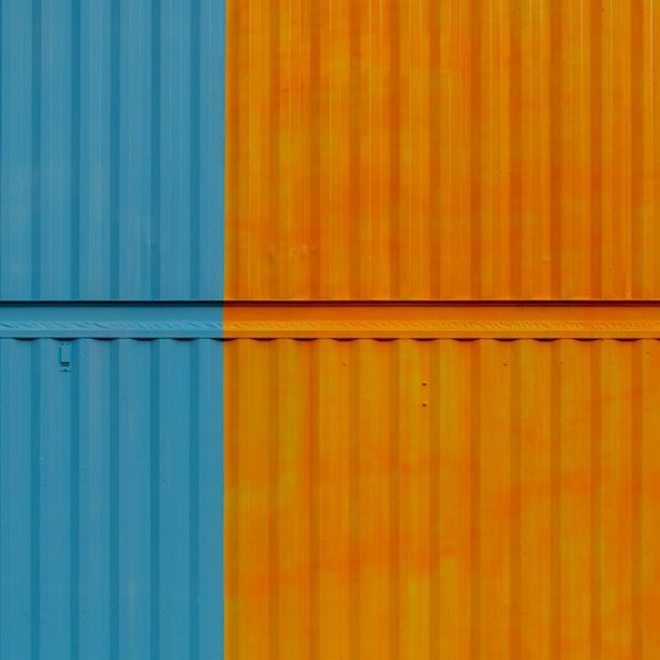 flat sides of containers, painted blue and orange