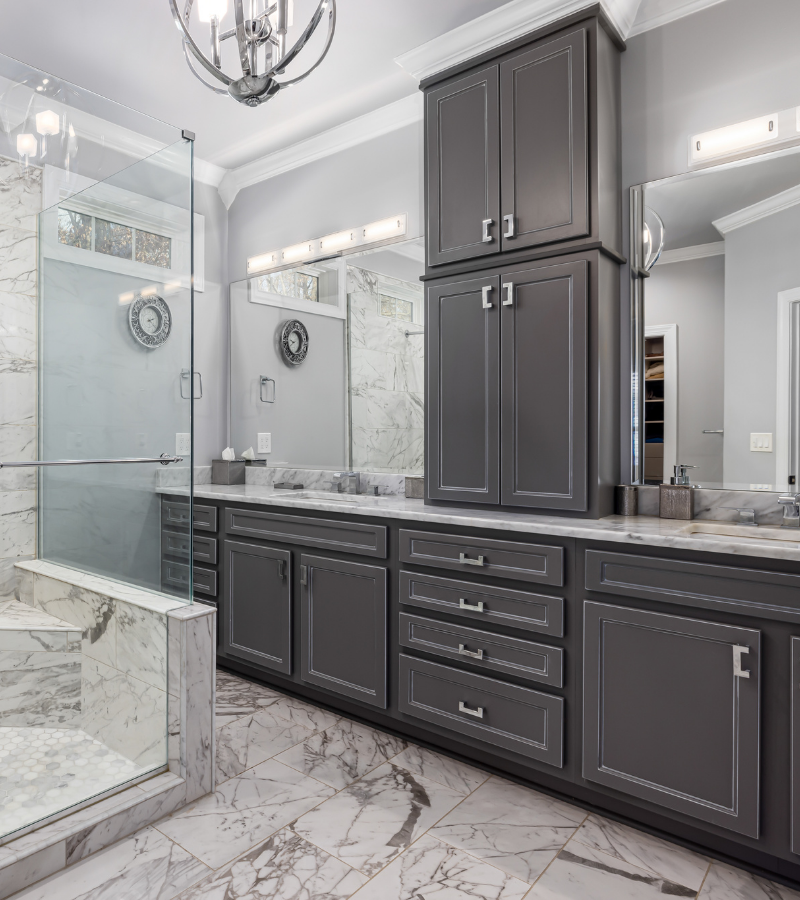 A close-up view of a professionally painted grey bathroom vanity, showcasing a smooth, durable finish that elevates the space.