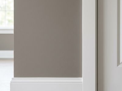 A close up of brown walls and white trim in a home