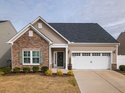A house with a freshly painted brown siding