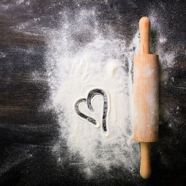 rolling pin next to a heart drawn in flour
