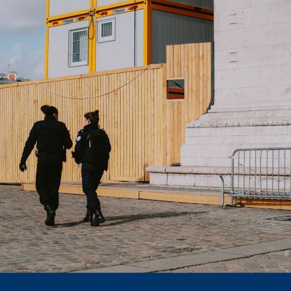 Two security guards walking throughout construction zone