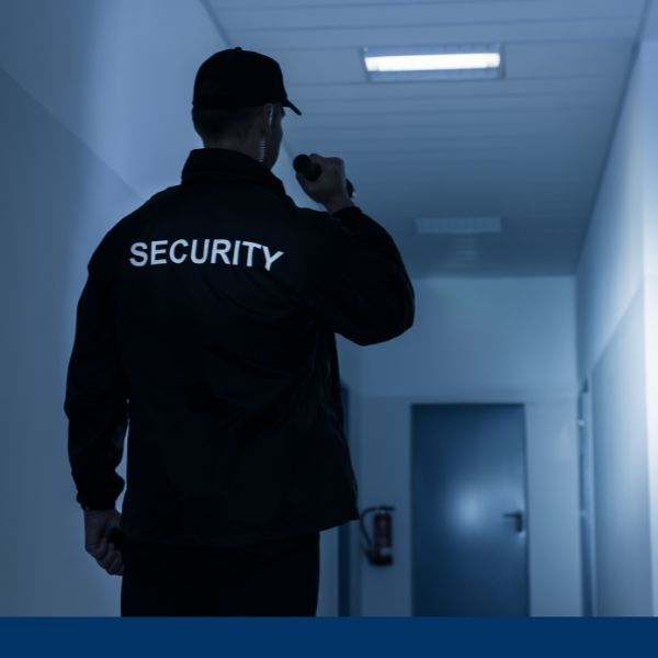 security detail patrolling hallway with flashlight security detail patrolling hallway with flashlight